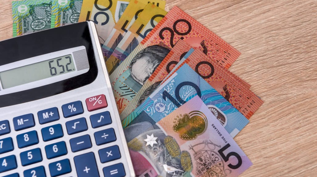 Can I Claim AirPods on Tax in Australia At Latitude Accountants. Australian currency with a calculator for tax calculation.